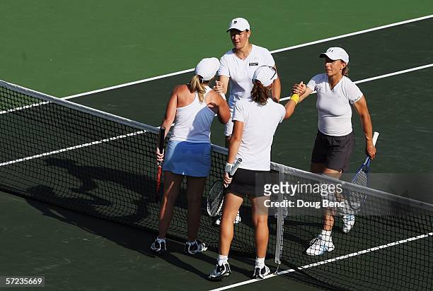 Martina Navratilova and Leisel Huber of South Africa congratulate Samantha Stosur of Australia and Lisa Raymond for winning the women's doubles final...