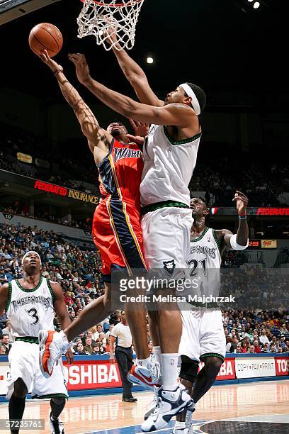 Derek Fisher of the Golden State Warriors goes up to the basket against Eddie Griffin of the Minnesota Timberwolves on April 2, 2006 at the Target...