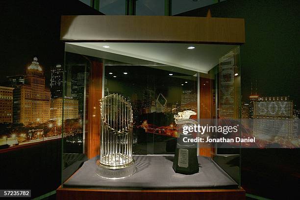 The World Series and American League Championship trophies are on display for the Opening Day game between the Chicago White Sox and the Cleveland...