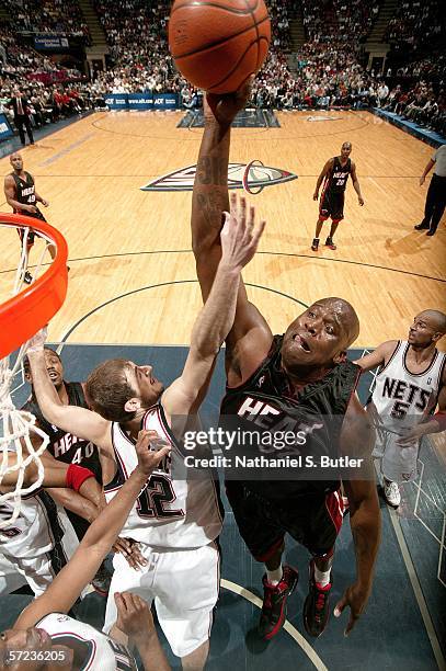 Shaquille O'Neal of the Miami Heat dunks against Nenad Krstic of the New Jersey Nets on April 2, 2006 at the Continental Airlines Arena in East...