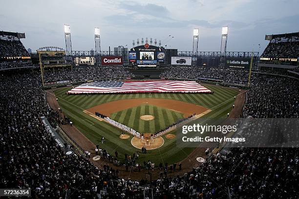 Giant U.S. Flag is unfurled during the National Anthem prior to the start of the Opening Day game between the Cleveland Indians and the Chicago White...