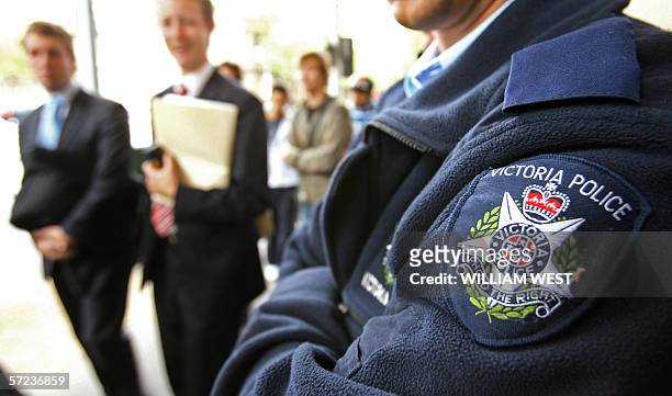 Victorian police maintain a heavy presence outside the Melbourne Magistrates Court 03 April 2006 after an Australian authorities accused a Muslim man...