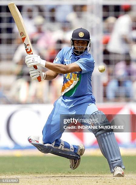 Indian cricketer Suresh Raina defends the wicket during the third One-Day International cricket match between India and England at the Jawaharlal...