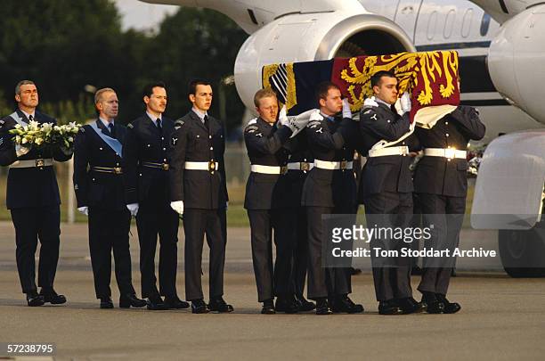 Princess Diana's body is carried by airmen after it was brought back from Paris, to RAF Northolt, after the car crash which killed her.