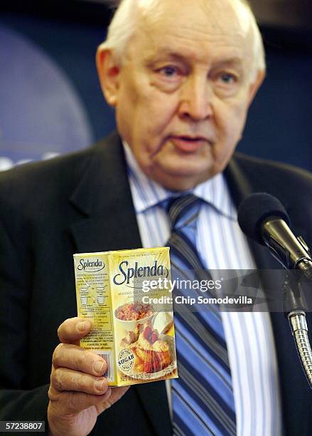 Chairman of the board of Citizens for Health, Jim Turner, holds a box of the artificial sweetener Splenda during a press conference at the National...