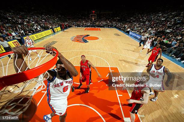 Qyntel Woods of the New York Knicks dunks against the Toronto Raptors at Madison Square Garden on March 21, 2006 in New York City. The Raptors won...