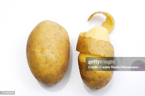 peeled potato, elevated view - peau de fruit photos et images de collection