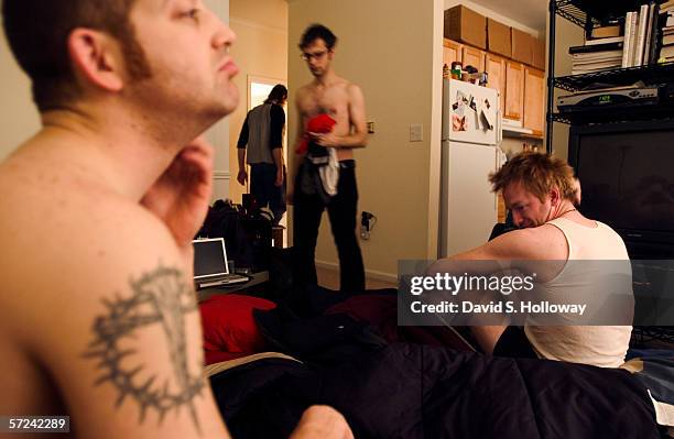 Members of Decahedron wake up on the livingroom floor of a man they met at their show the previous night on February 05, 2004 in Columbia, South...