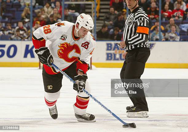 Robyn Regehr of the Calgary Flames skates with the puck during the game against the St. Louis Blues on January 30, 2006 at the Savvis Center in St....