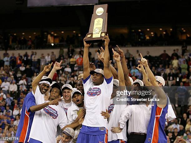 Adrian Moss and the Florida Gators celebrate with the trophy after defeating the UCLA Bruins 73-57 during the National Championship game of the NCAA...
