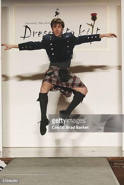Dancer Tom Gold walks the runway at the Johnnie Walker Dressed to Kilt fashion show at St John Divine Cathedral on April 3, 2006 in New York City.