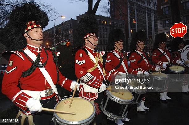 The Mystic Highland Pipe Band performs at the Johnnie Walker Dressed to Kilt fashion show at St John Divine Cathedral on April 3, 2006 in New York...