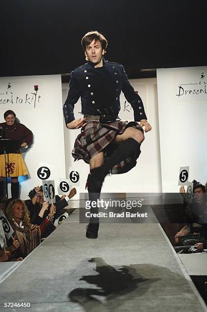 Dancer Tom Gold walks the runway at the Johnnie Walker Dressed to Kilt fashion show at St John Divine Cathedral on April 3, 2006 in New York City.
