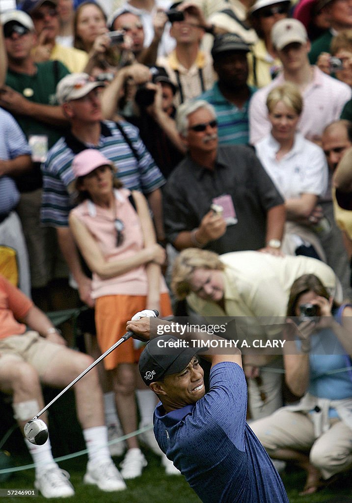 Tiger Woods of the US draws a large crow