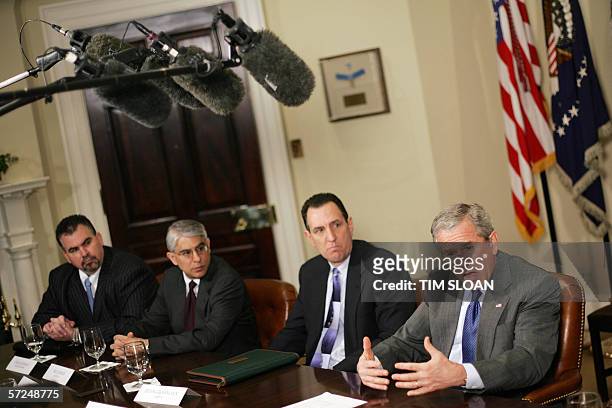 Washington, UNITED STATES: US President George W. Bush meets with representatives from insurance companies, banks and businesses that offer their...