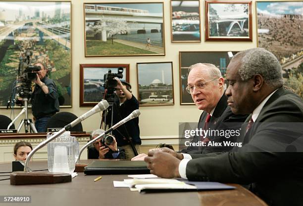 Supreme Court Associate Justice Anthony Kennedy speaks as Associate Justice Clarence Thomas listens during a hearing before a House subcommittee...