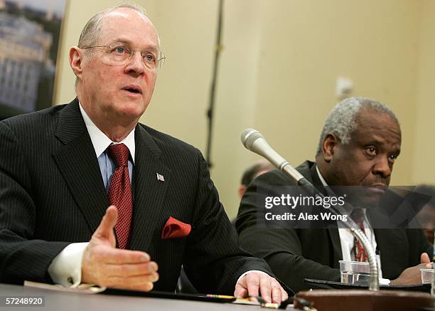 Supreme Court Associate Justice Anthony Kennedy speaks as Associate Justice Clarence Thomas listens during a hearing before a House subcommittee...