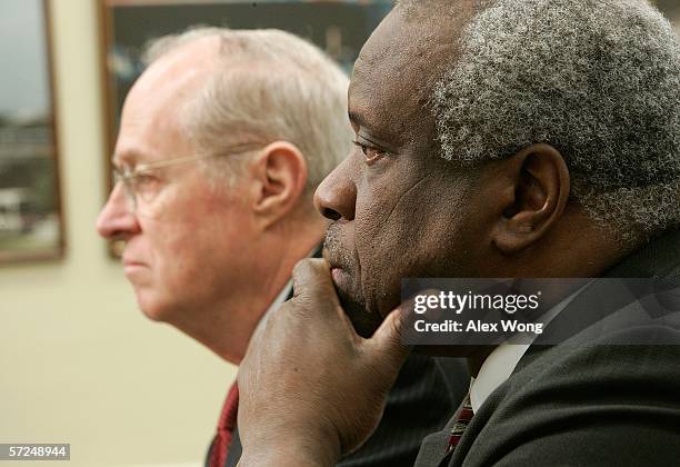 Supreme Court Associate Justice Anthony Kennedy speaks as Associate Justice Clarence Thomas listen to statements during a hearing before a House...