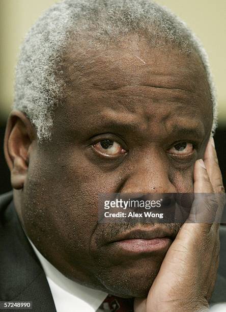 Supreme Court Associate Justice Clarence Thomas listens to questions during a hearing before a House subcommittee April 4, 2006 on Capitol Hill in...