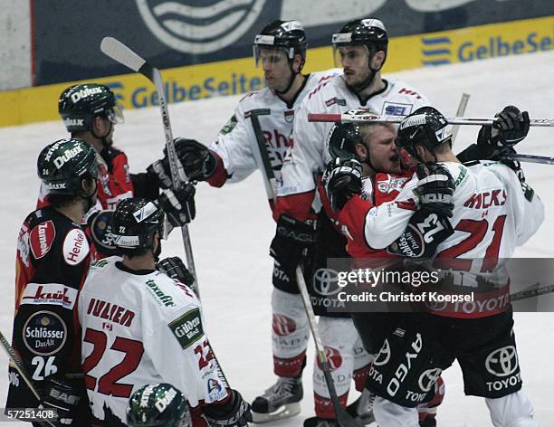 Daniel Kreutzer of the Metro Stars and Alex Hicks of the Haie have an altercation during the DEL play off semi-final third match between DEG Metro...