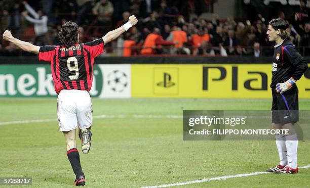 Lyon's goalkeeper Gregory Coupet looks at AC Milan's forward Filippo Inzaghi after he scored the second goal during quarter finals second leg...