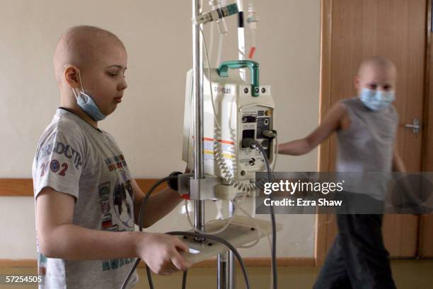 Pasha from the city of Baranovichi and Vova Kazakhstan walk down the hallway of the Children's Oncology Center on March 13, 2006 in Minsk, Belarus....