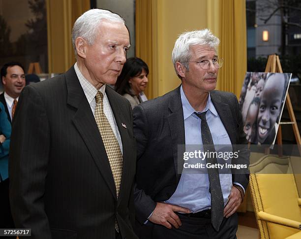Actor Richard Gere walks with Senator Orrin Hatch during a reception held at the MPAA by Friends of the Global Fight April 4 in Washington, DC.