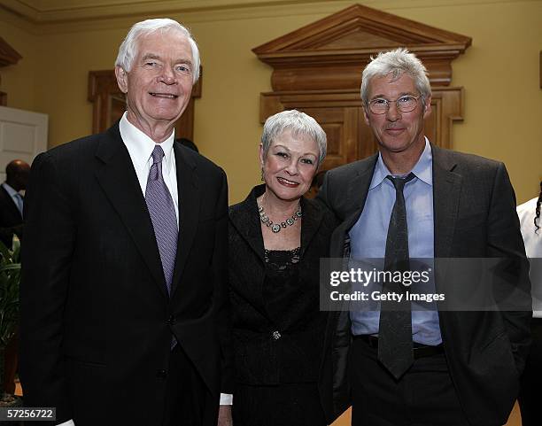 Actor Richard Gere poses with Senator Thad Cochran and Kay Webber , the senator's director of special services, during a reception held at the MPAA...