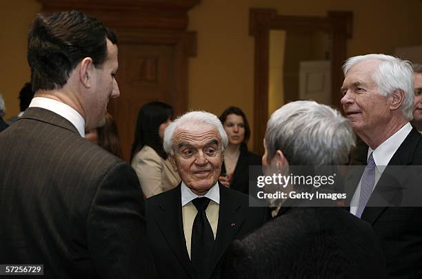Former MPAA President Jack Valenti speaks with Senators Rick Santorum , Thad Cochran and Cochran's director of special services Kay Webber during a...
