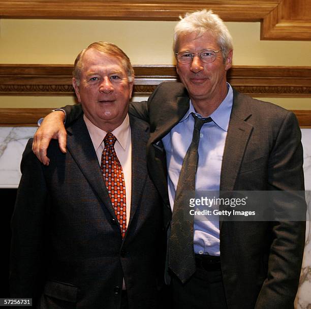Actor Richard Gere poses with Ed Scott, founder and chairman of Friends of the Global Fight during a reception held at the MPAA April 4 in...