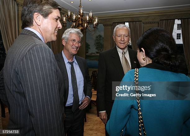 Actor Richard Gere speaks with Gordon Smith , Senator Orrin Hatch and Senator Olympia Snowe a reception held at the MPAA by Friends of the Global...