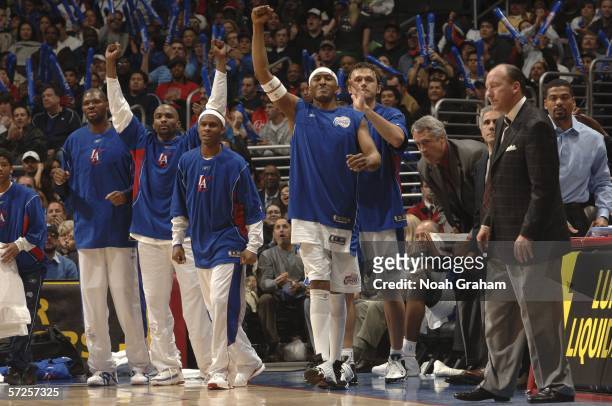 James Singleton, Walter McCarty, Cuttino Mobley, Daniel Ewing, Zeljko Rebraca and Head Coach Mike Dunleavy of the Los Angeles Clippers celebrate...