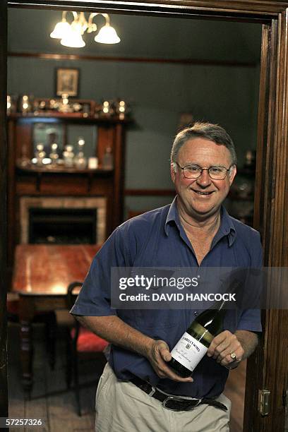 General manager of family-owned business Tyrrells Wines, Bruce Tyrrell holds his award-winning 2004 chardonnay in the 19th century boardroom of their...