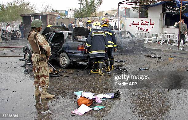 School bag and copybooks of a wounded boy are seen scattered on a street at the site where a car bomb exploded in Baghdad, 05 April 2006. At least...