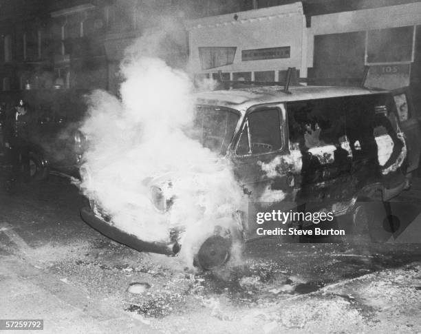 Van burning during a night of rioting in Brixton, London, 16th July 1981.