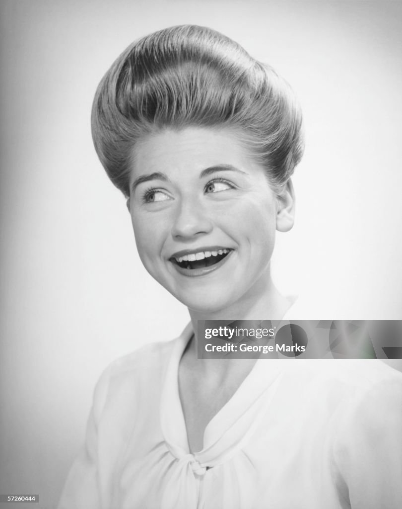 Woman glancing, posing in studio, (B&W), close-up, portrait
