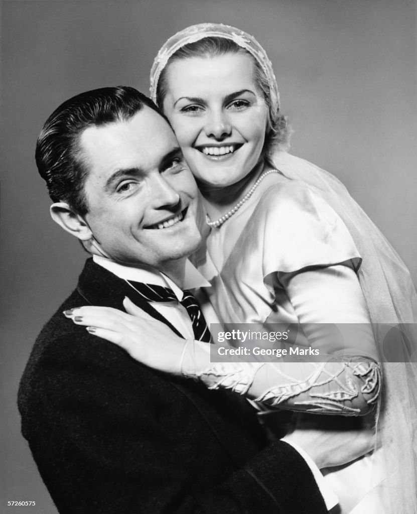 Young smiling couple, (B&W), portrait