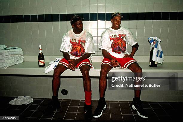 Michael Jordan and Scottie Pippen of the Chicago Bulls celebrate in the locker room after winning the 1998 NBA Championship against the Utah Jazz on...