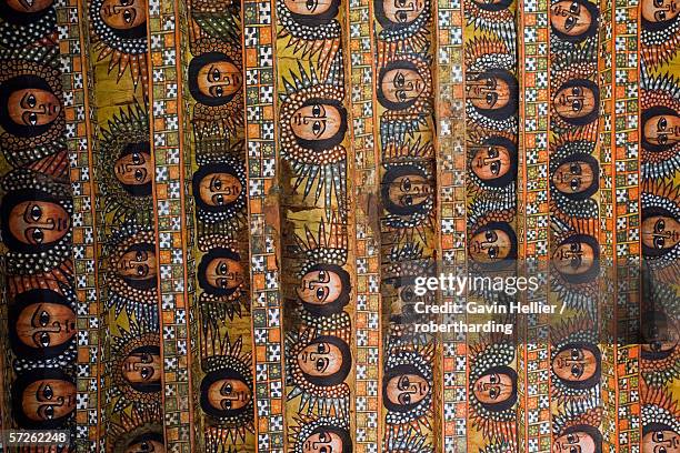 the famous painting on the ceiling of the winged heads of 80 ethiopian cherubs, unesco world heritage site, trinity of the mount of light, gonder, debre selassie church, ethiopia, africa - ethiopia fotos stock-fotos und bilder