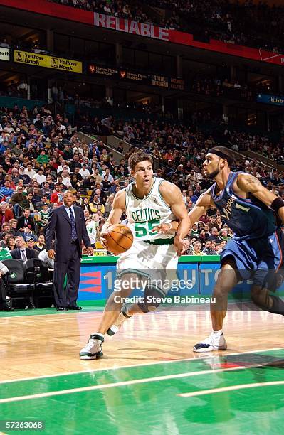 Wally Szcerbiak of the Boston Celtics drives against Jared Jeffries of the Washington Wizards April 5, 2006 at the TD Banknorth Garden in Boston,...