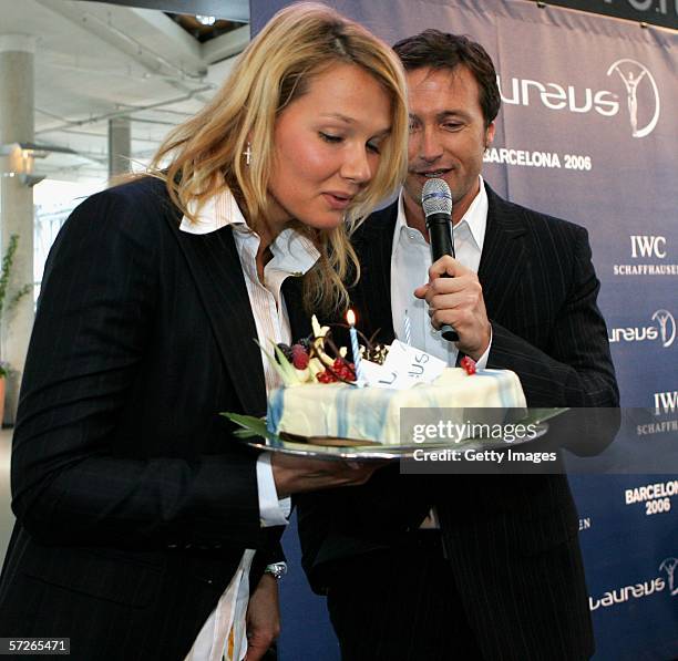 Celebrated german swimmer Franziska van Almsick receives a birthday cake from Norbert Dobeleit during the announcment of the nominations for the 7th...