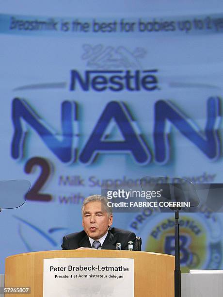 Lausanne, SWITZERLAND: Chairman and CEO of Nestle, Peter Brabeck-Letmathe, delivers a speech as a can of baby milk powder "Nan 2" appears on the...