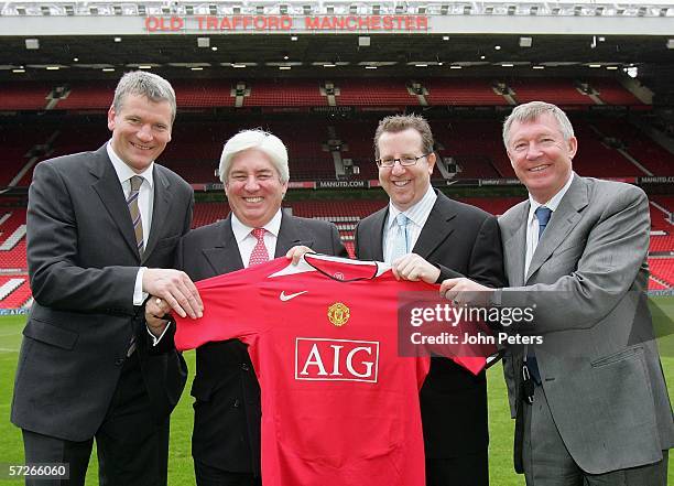 David Gill of Manchester United poses with Martin Sullivan , CEO of AIG, Sir Alex Ferguson and Bryan Glazer after the press conference to announce...