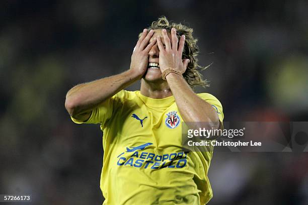 Diego Forlan of Villarreal holds his head after he misses a chance during the Champions League Quarter Final Second Leg match between Villarreal and...