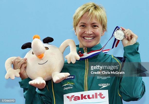 Brooke Hanson of Australia poses for photographers after winning a silver medal in the Women's 50m breaststroke final during day two of the FINA...