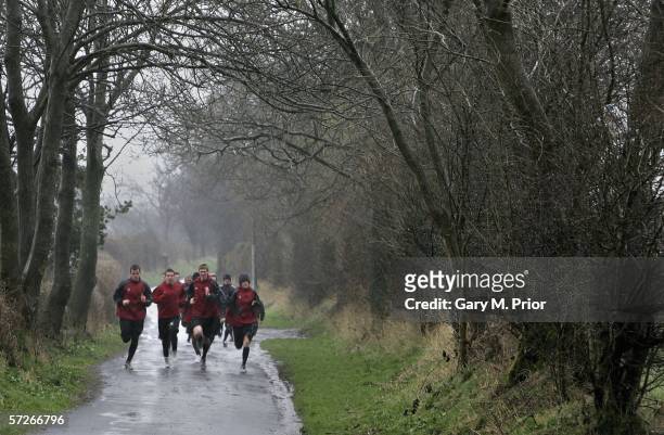 Accrington Stanley players go out jogging in the rain at the Rolls Royce training ground on April 6, 2006 in Barnoldswick, England.