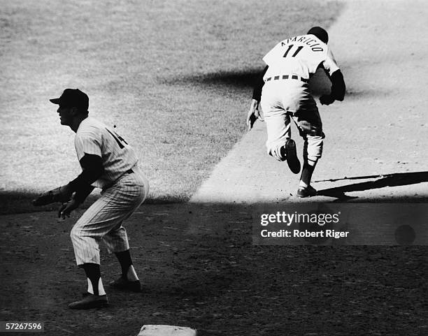 American professional baseball player Bill Skowron , first baseman of the New York Yankees, waits for the ball while Venezuelan opponent Luis...