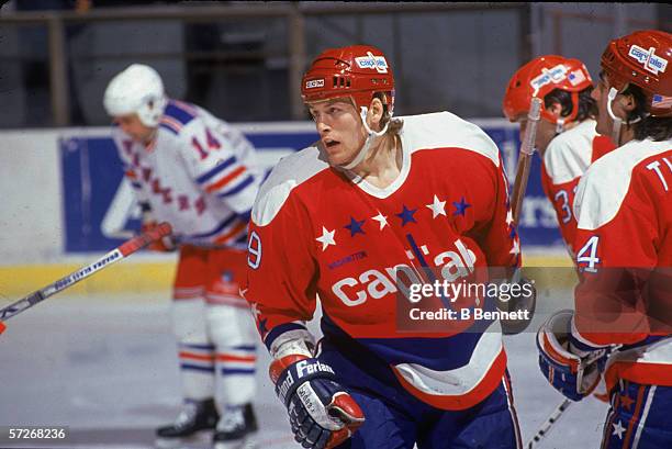 Canadian professional hockey player John Druce of the Washington Capitals skates on the ice during a road game against the New York Rangers, Madison...