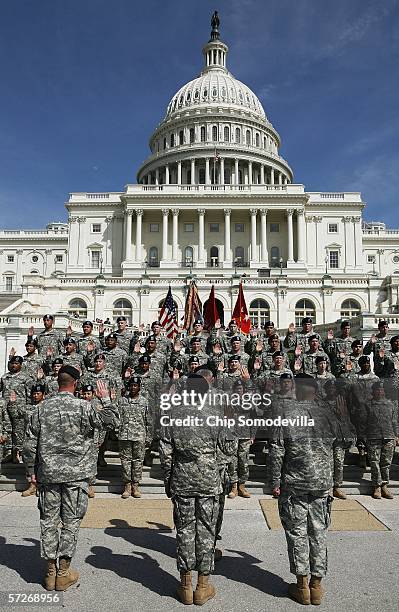 Forty United States Army Reservists raise their right hands and take the oath to reenlist on the West Steps of the U.S. Capitol April 6, 2006 in...