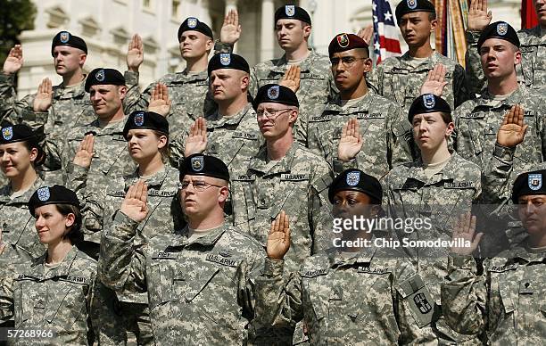 Forty United States Army Reservists raise their right hands and take the oath to reenlist on the West Steps of the U.S. Capitol April 6, 2006 in...